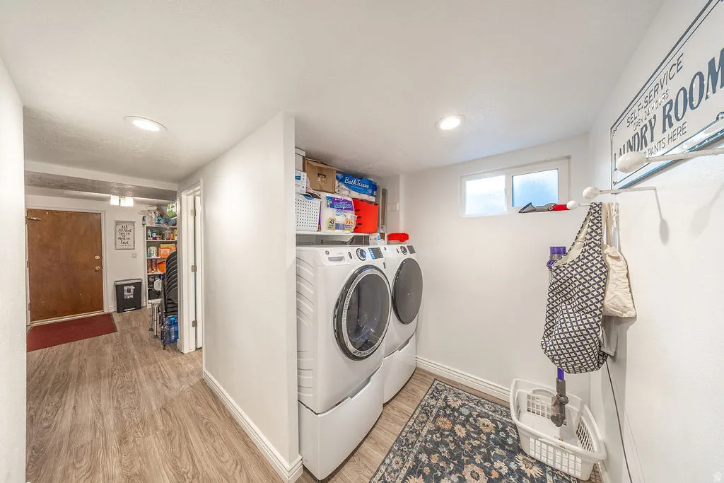 Dedicated laundry space featuring stacked appliances