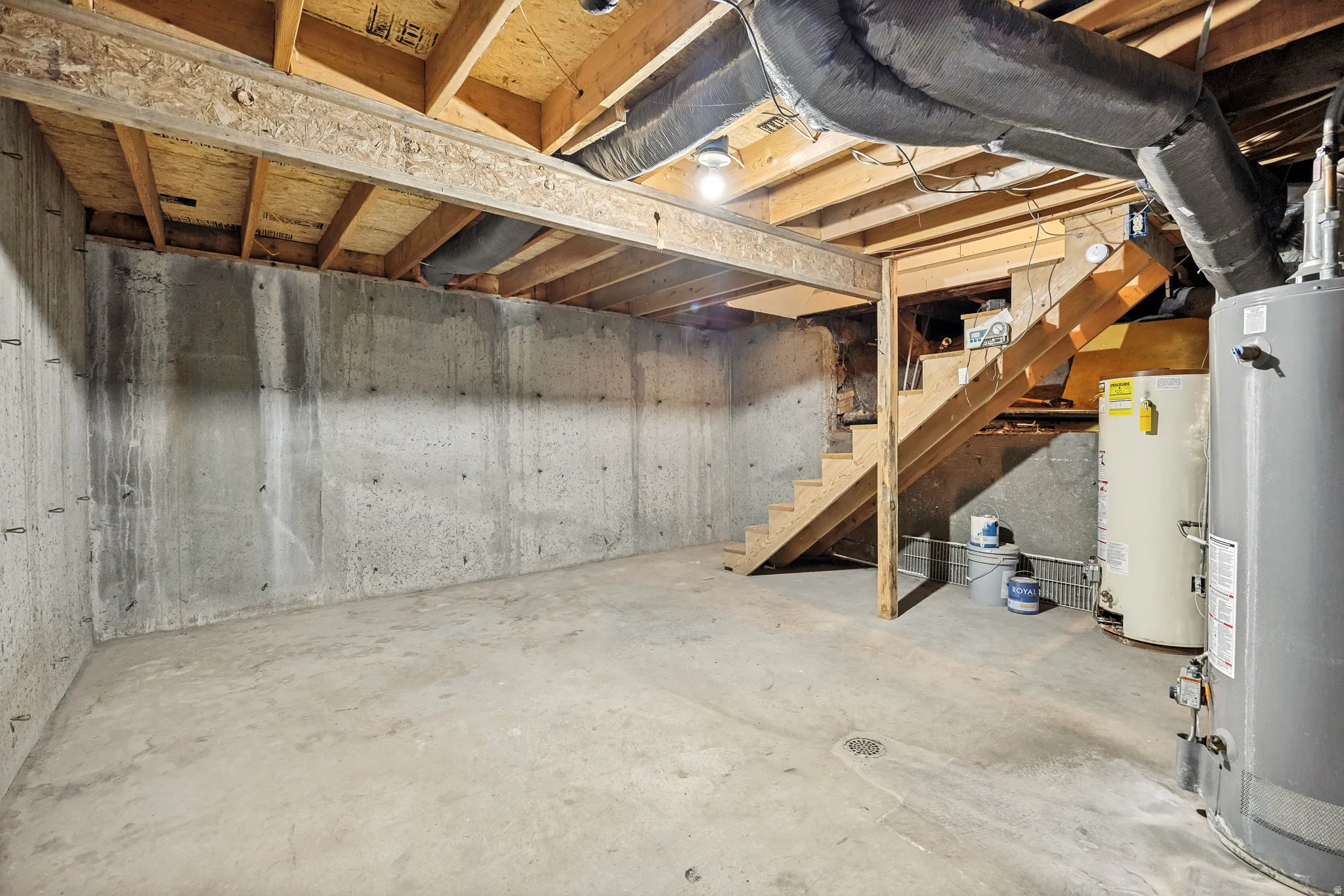 Unfinished basement with concrete walls and flooring