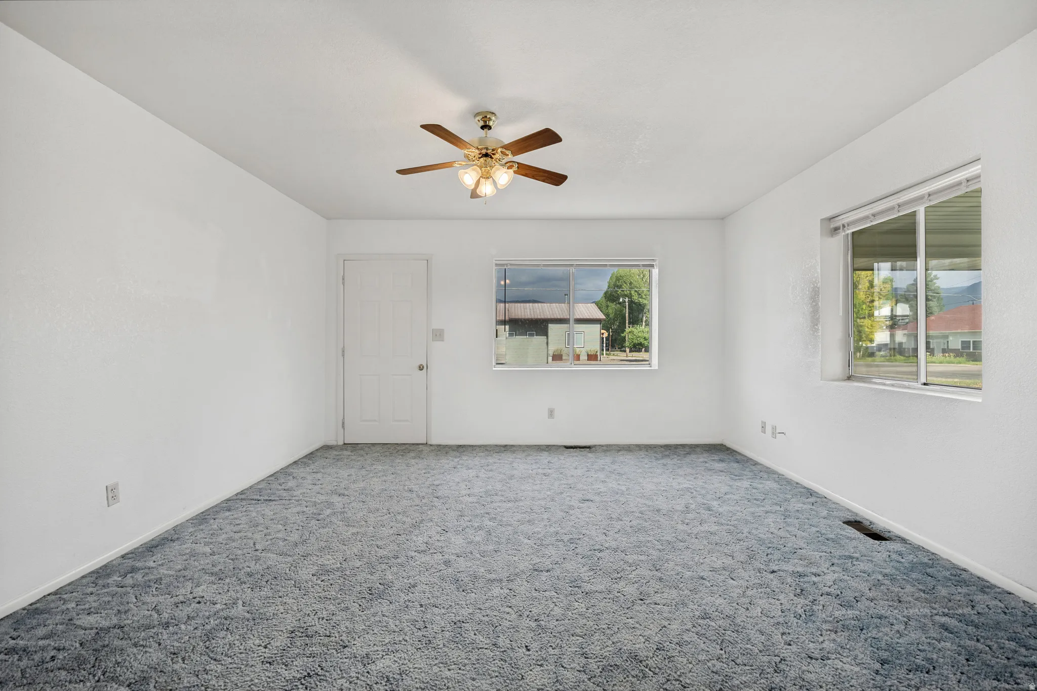 Spacious family room with lots of natural light open to sites to kitchen.