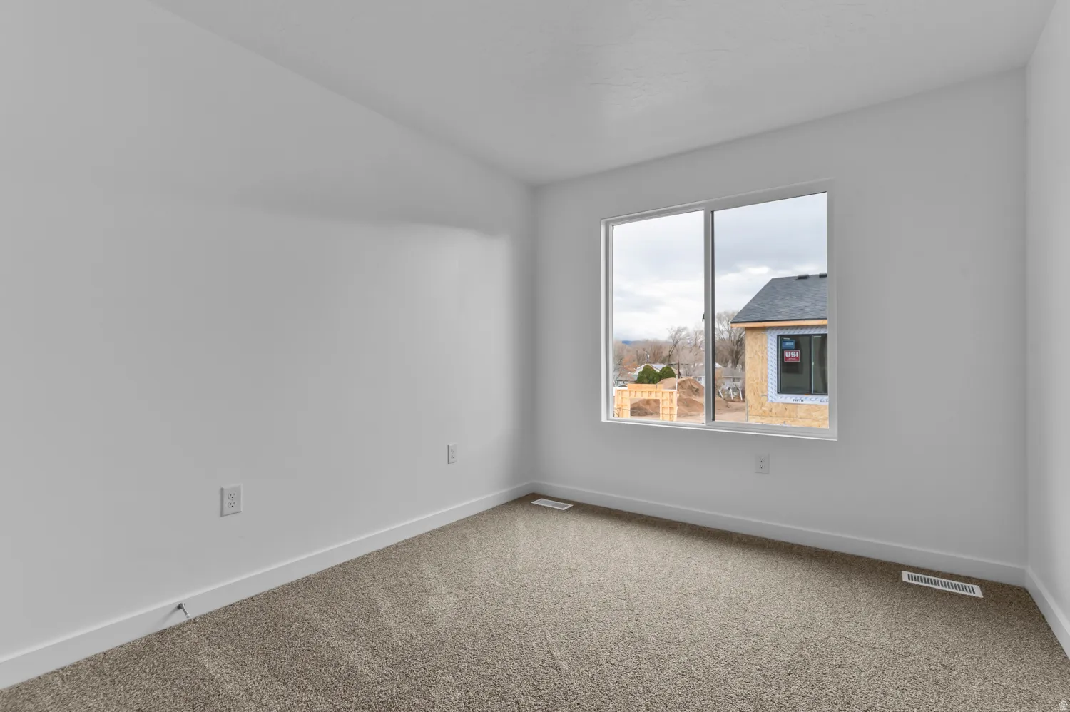 Neutral-toned carpeting paired with white walls