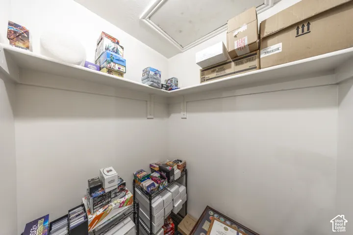 Storage area with white painted walls and ceiling