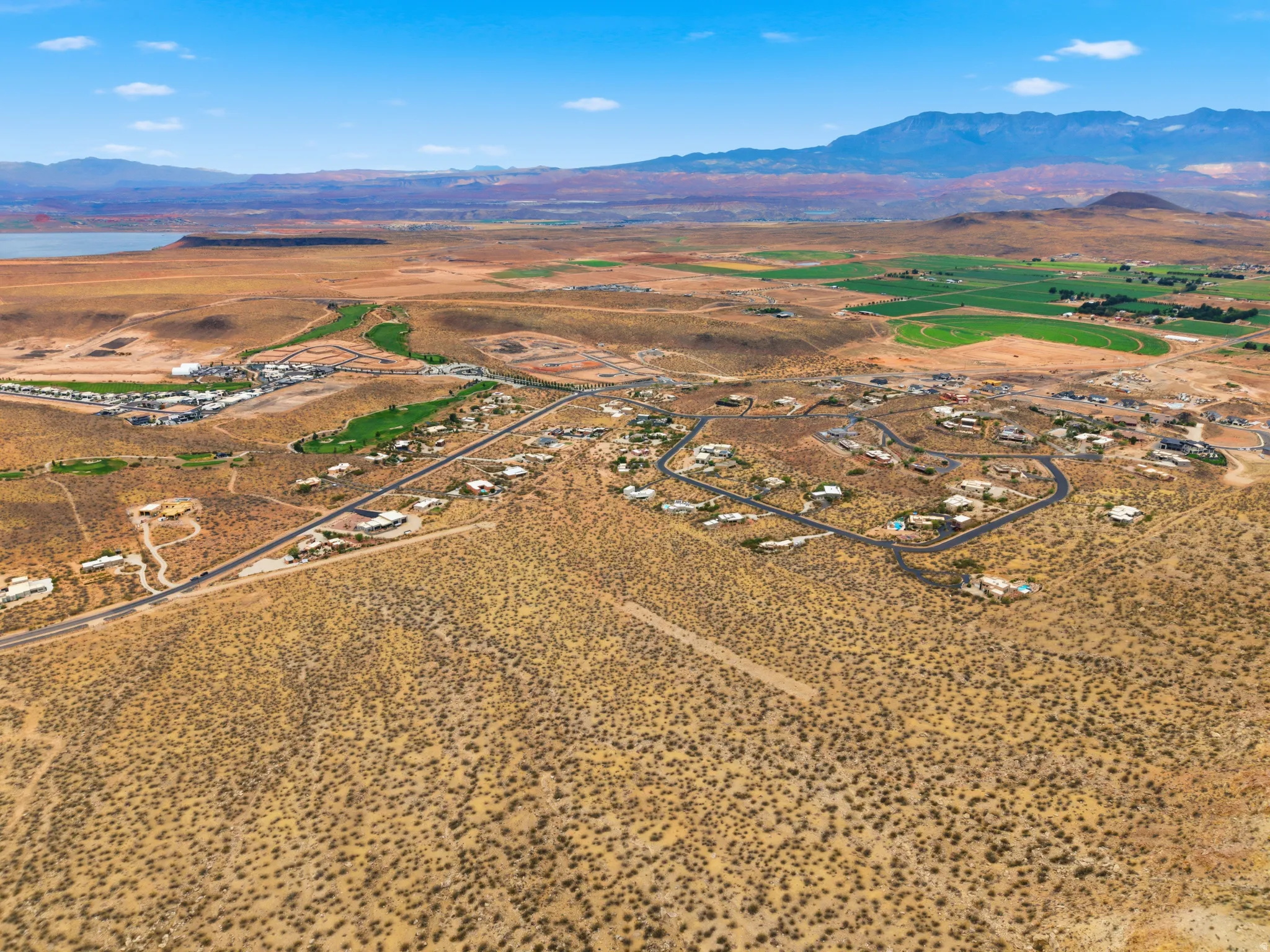 Expansive aerial showcasing a residential development within a desert landscape
