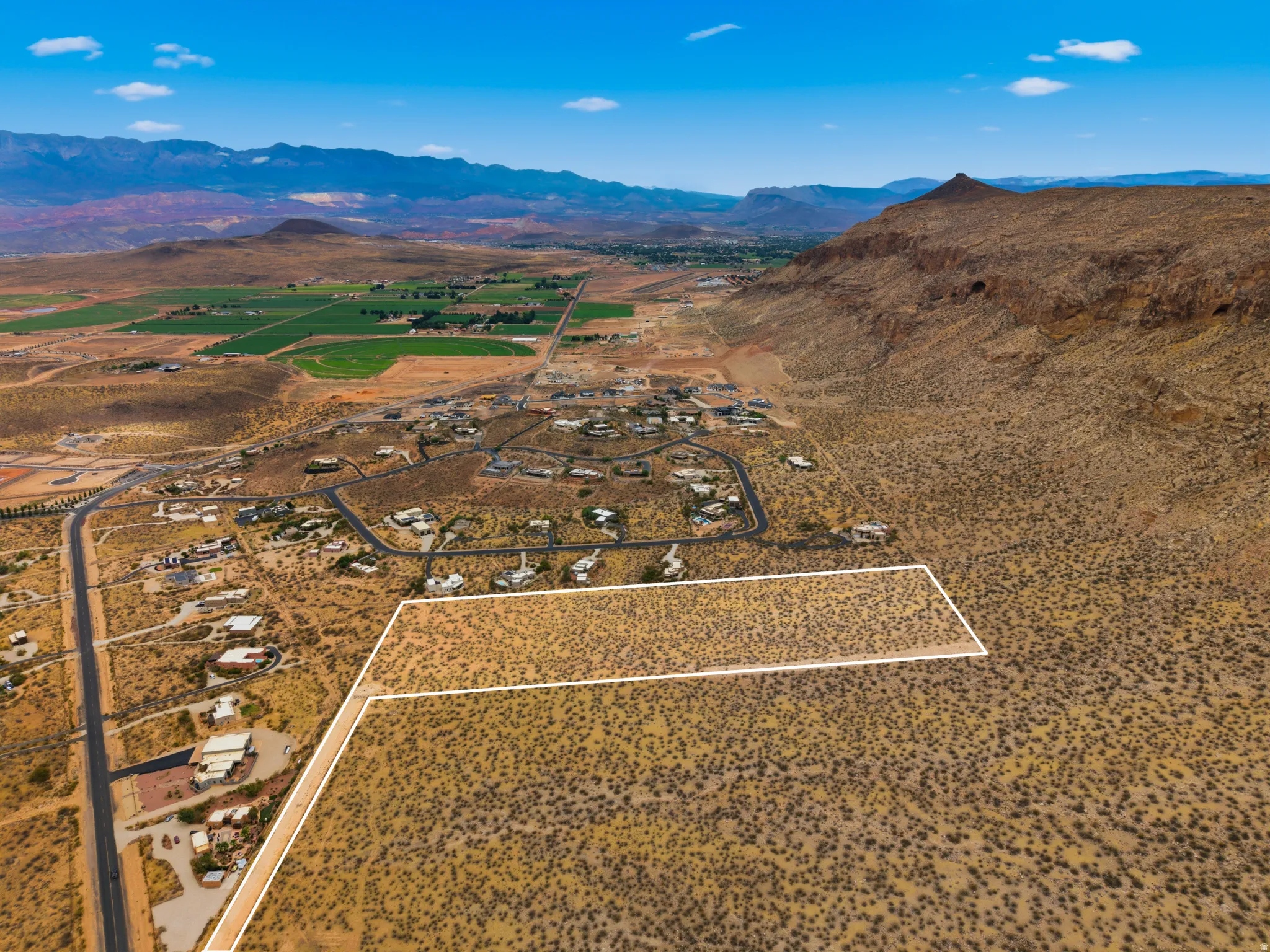 Expansive desert landscape with a mountainous backdrop