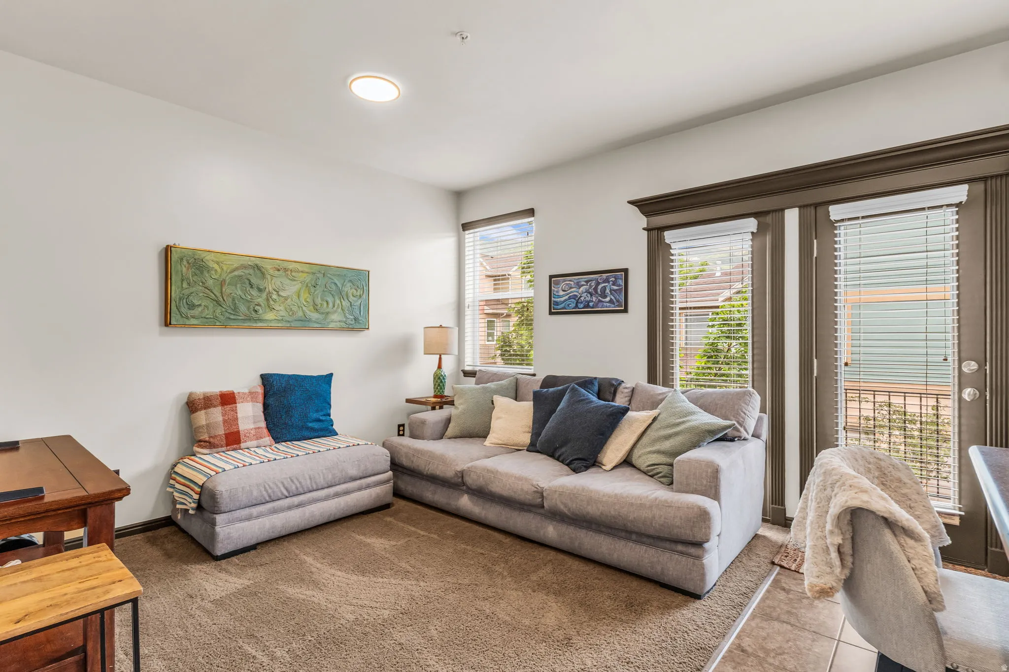 Living area featuring carpeted flooring and white walls