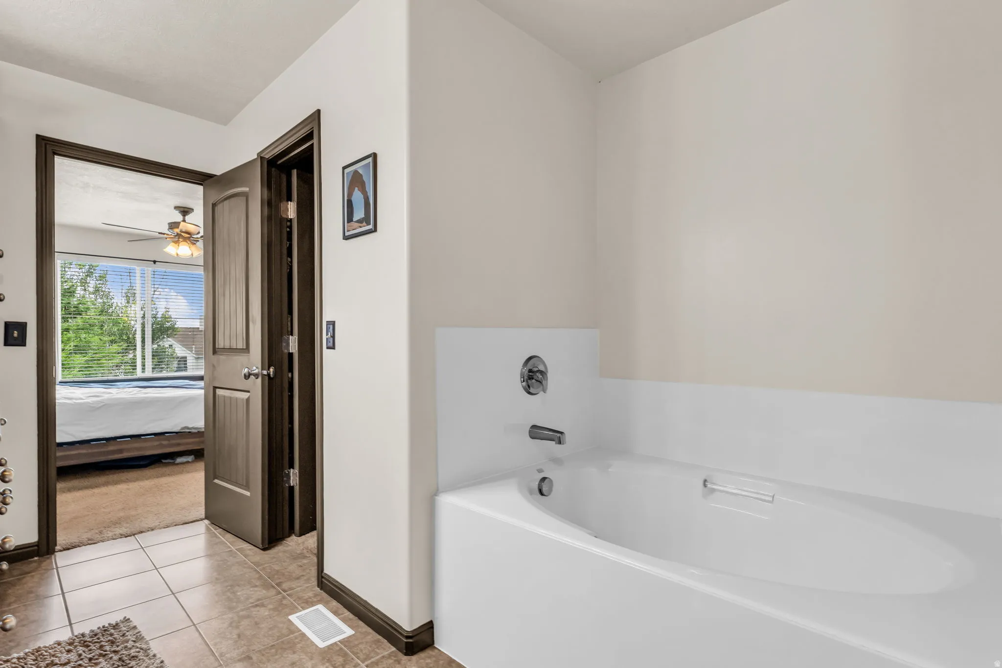 Built-in soaking tub with chrome fixtures
