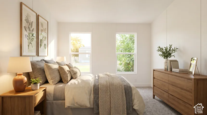 Interior room featuring two large windows, white walls, and light-colored carpeting
