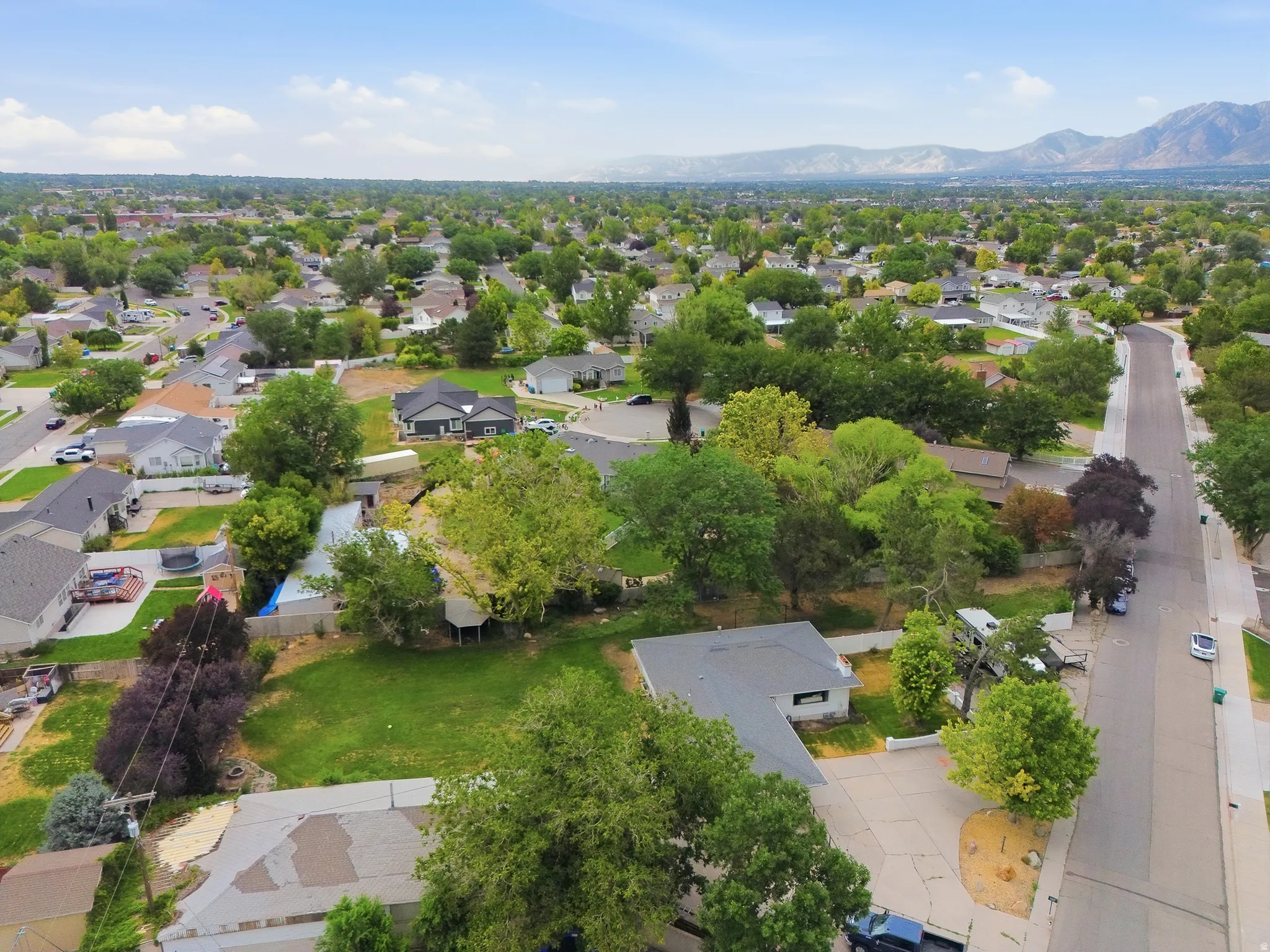 Birds eye view of 3/4 acre lot, home and 1200 detached shop/garage.