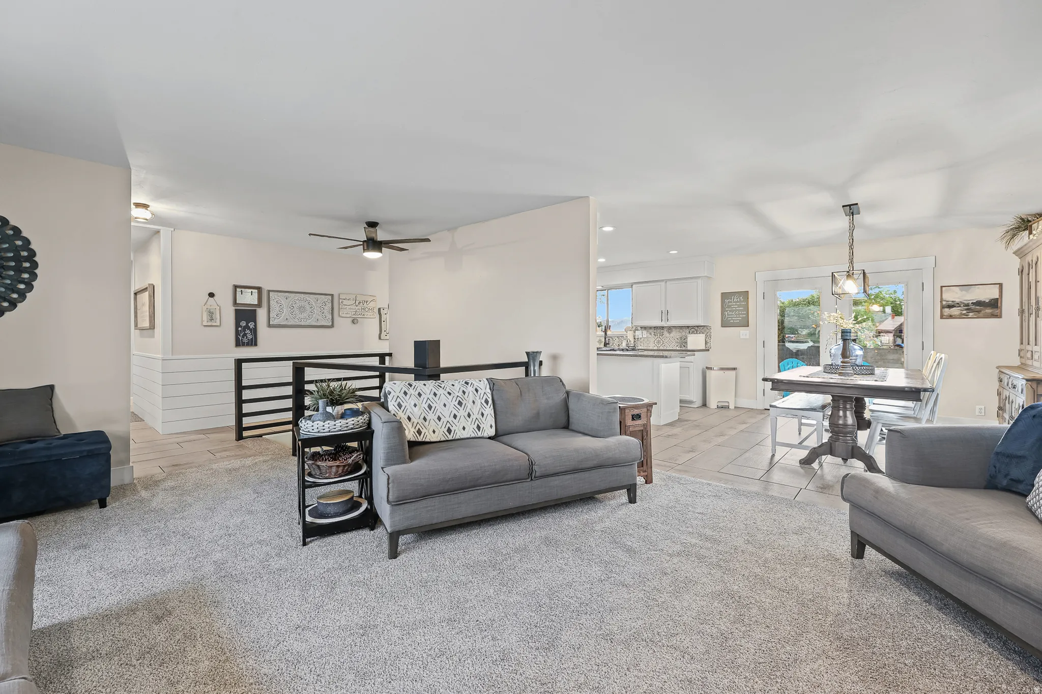 Open-concept living area with new carpet