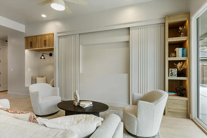 Integrated built-in cabinetry and shelving featuring wood-finish elements and backlighting
