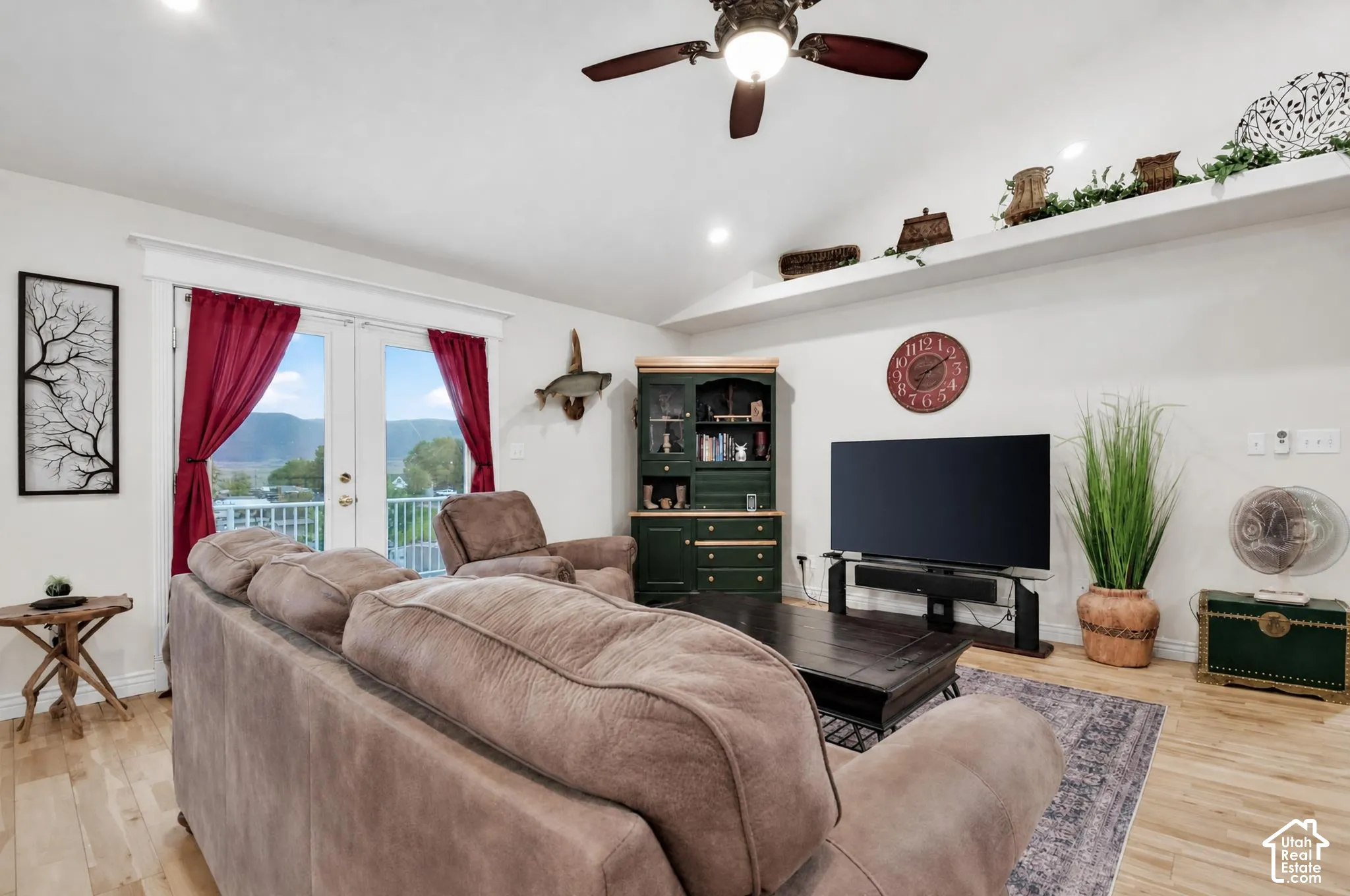 Grear room wit vaulted ceiling and ample natural lighting.  French doors leading to large viewing deck
