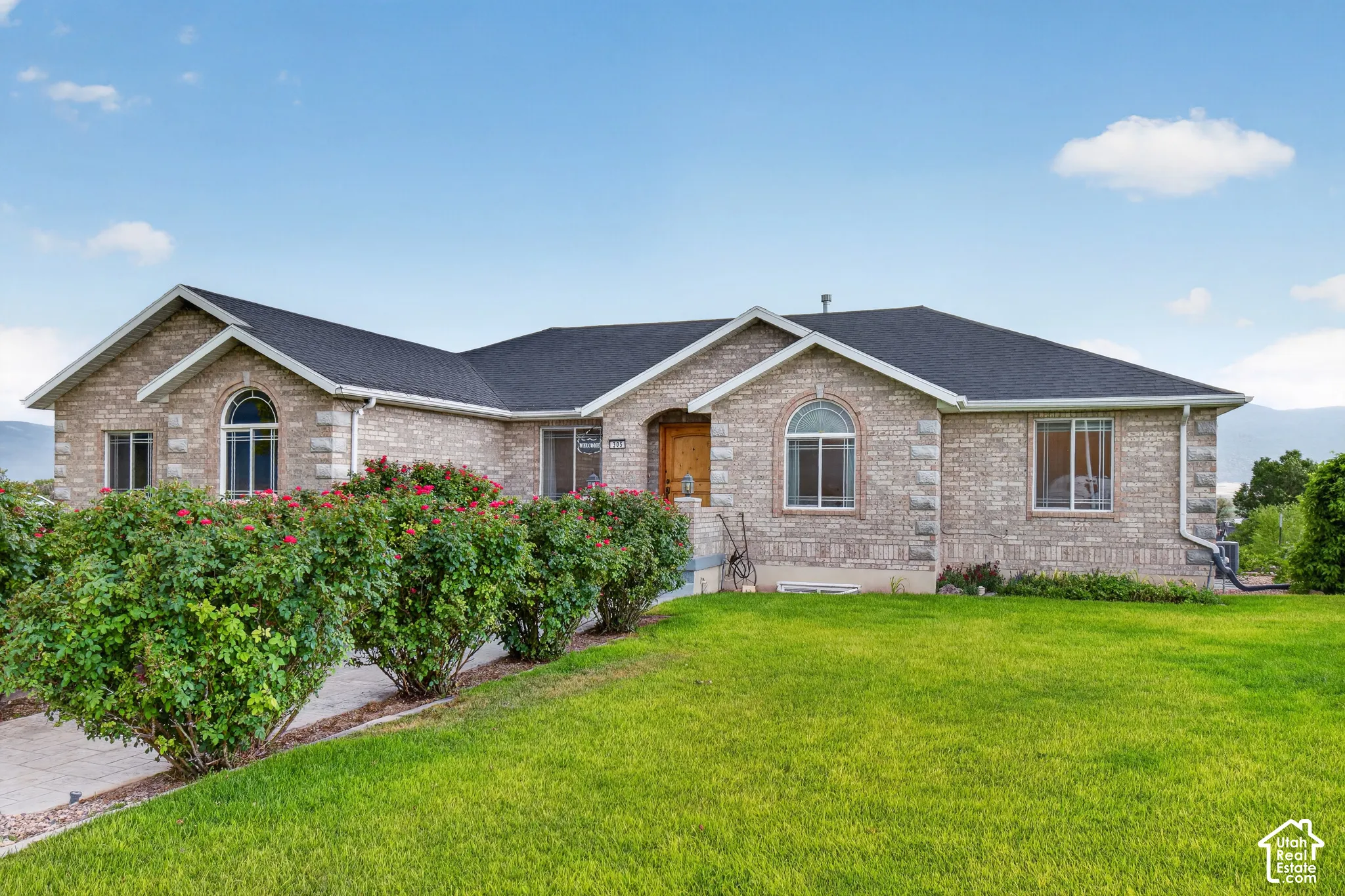 Traditional-style brick exterior with an arched window accent