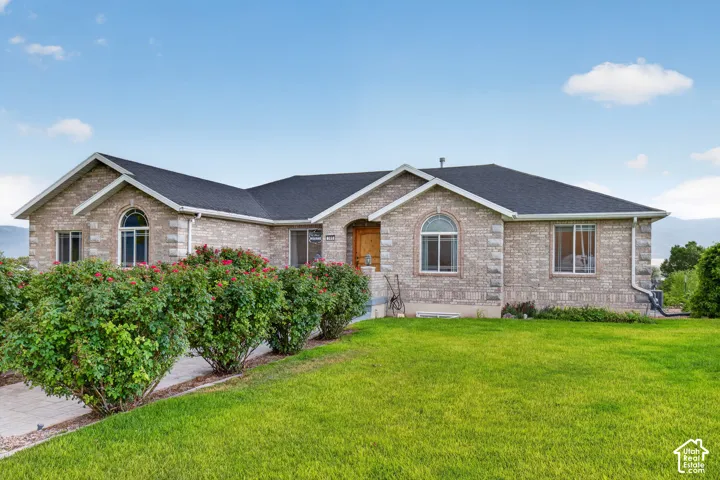 Traditional-style brick exterior with an arched window accent