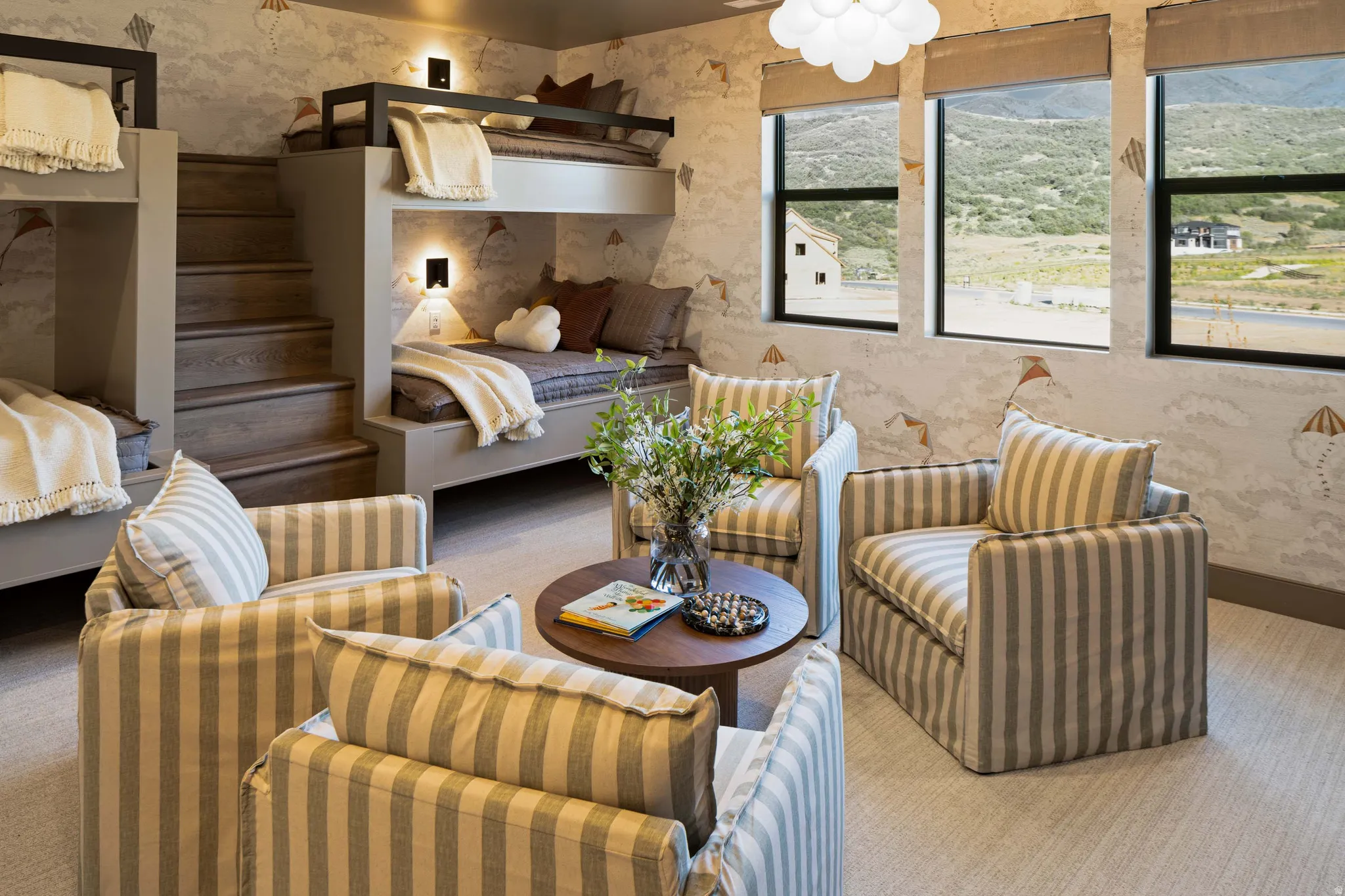 Built-in bunk beds with integrated staircase and individual sconce lighting