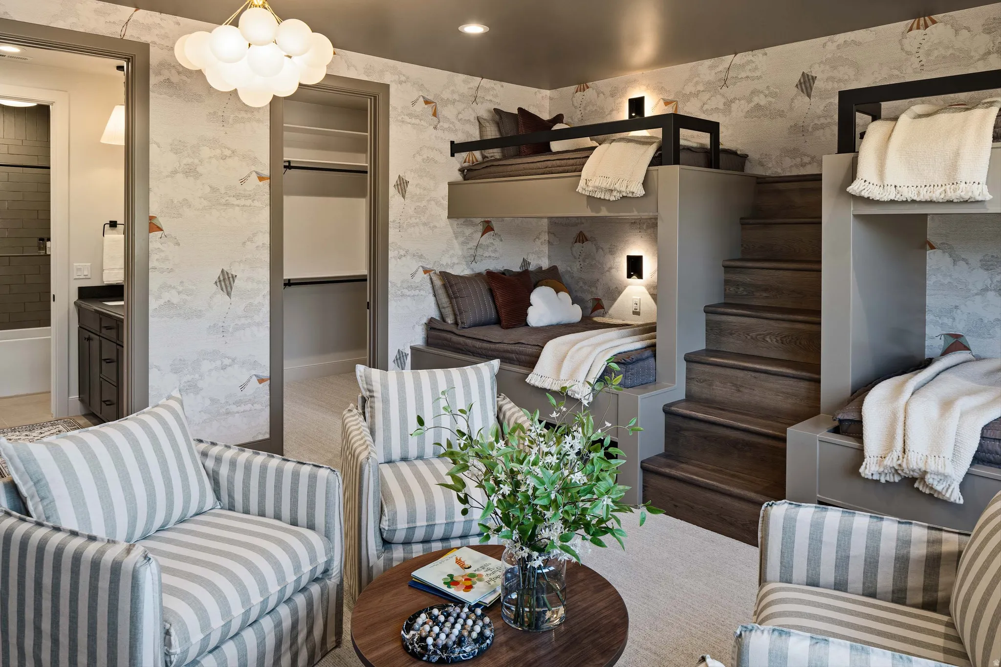 Built-in bunk beds with integrated wood-finish steps and recessed lighting