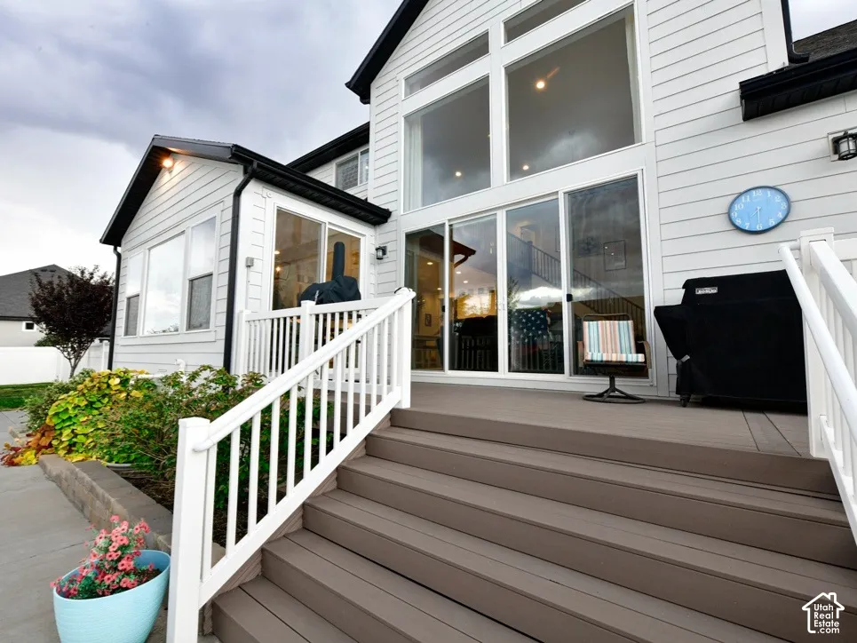 Expansive rear deck with composite flooring and white railings