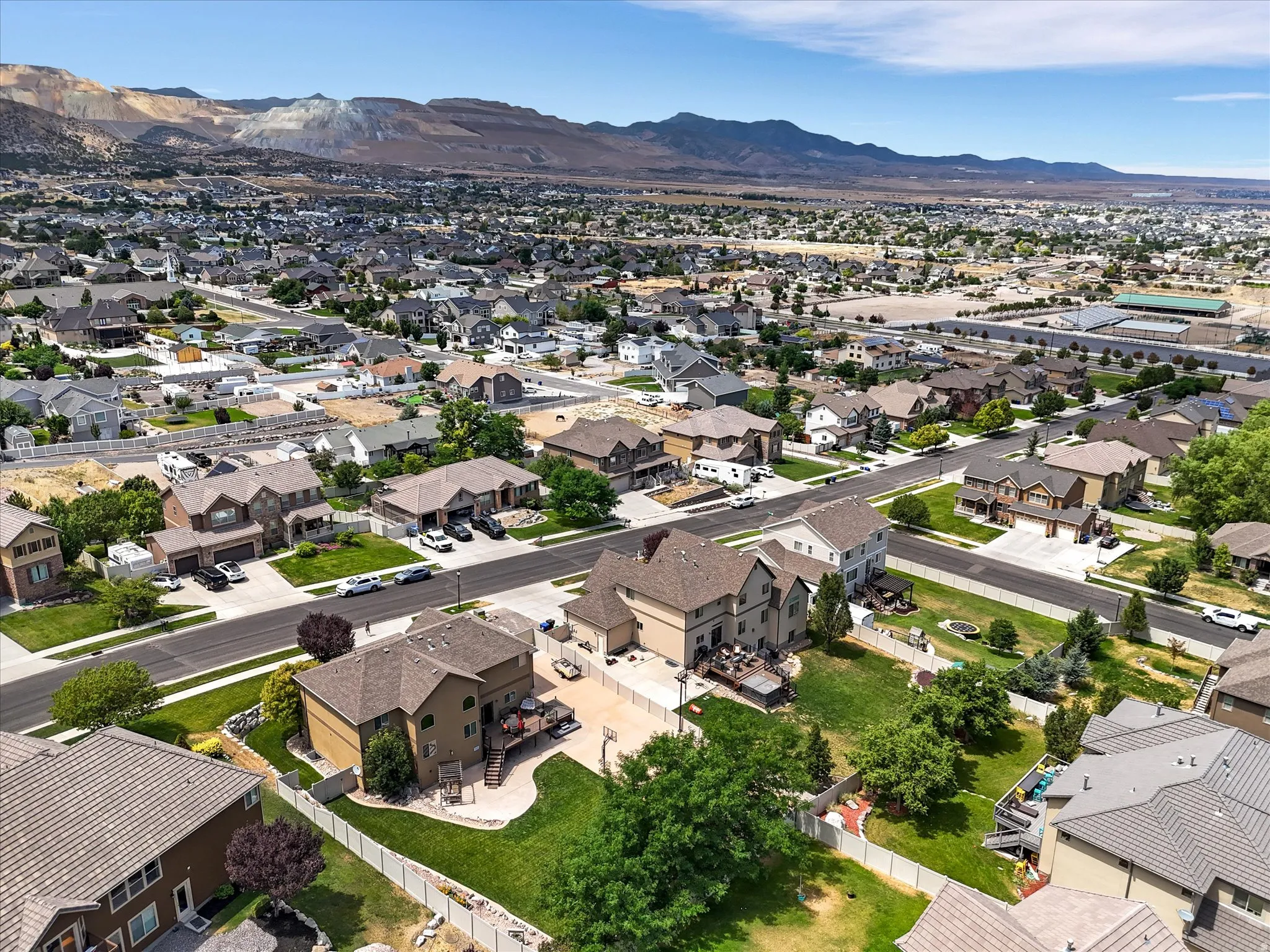 Residential neighborhood featuring single-family homes with pitched roofs and varied exterior finishes