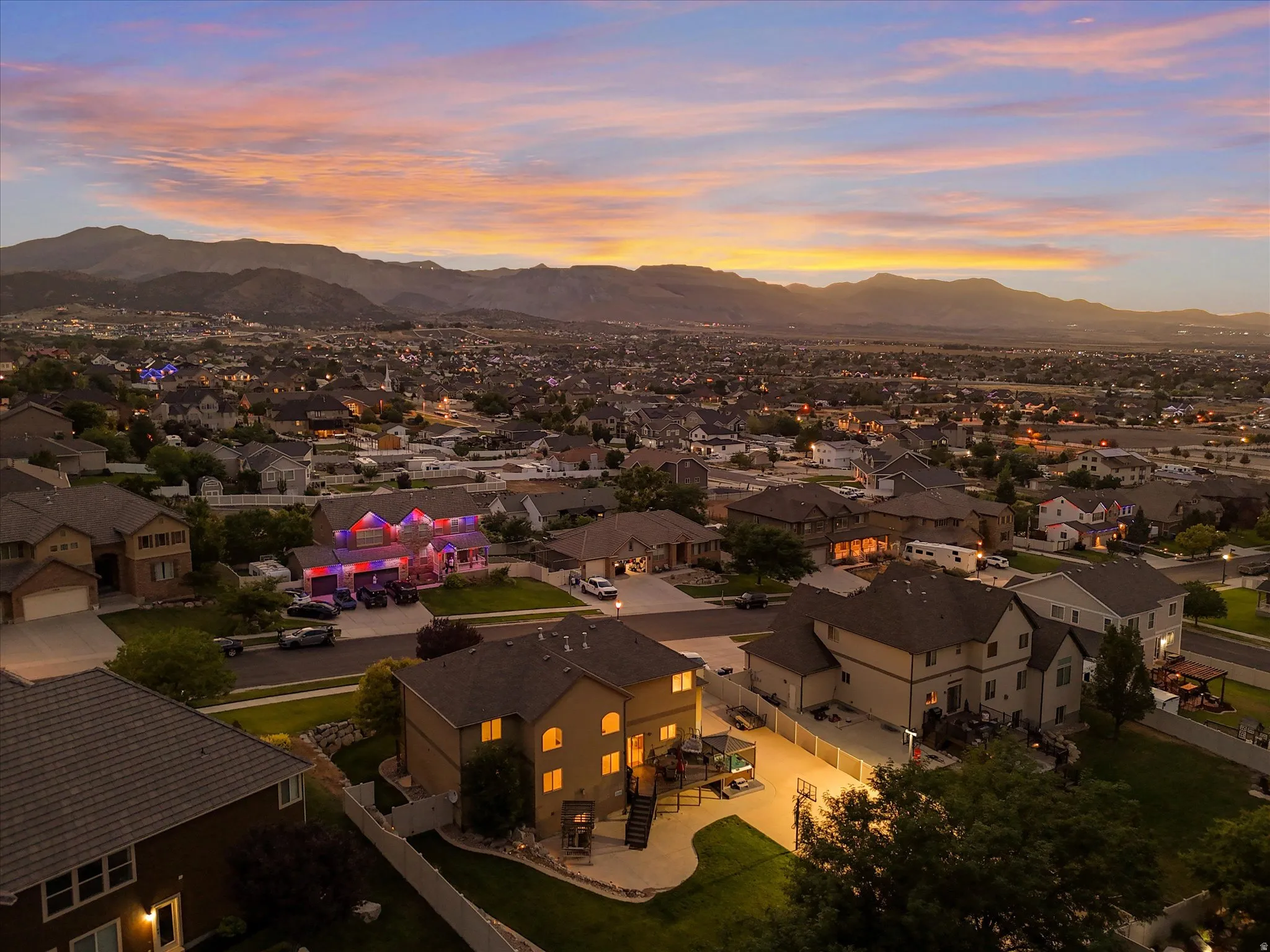 Suburban residential landscape featuring a distant mountain range