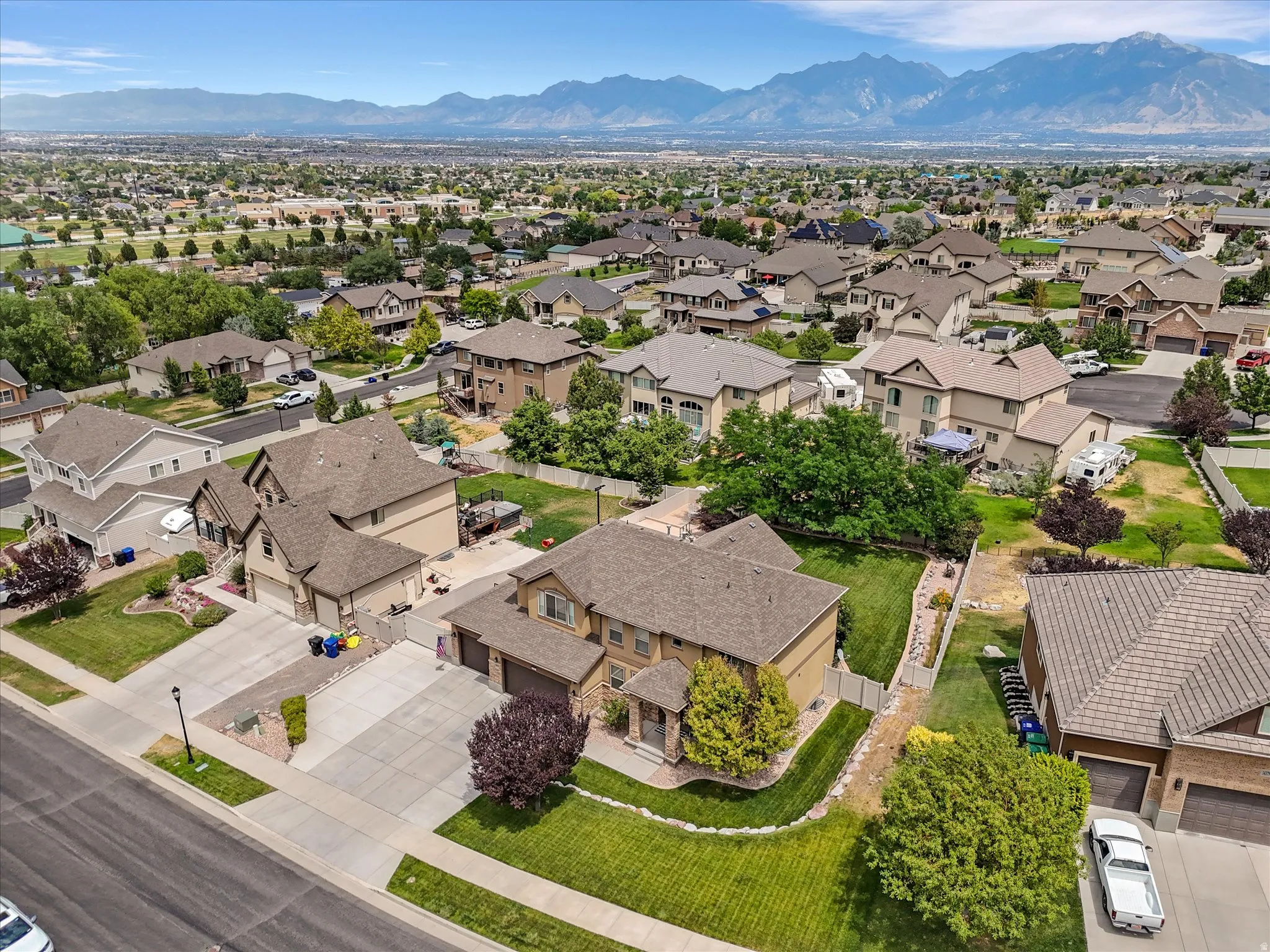 Expansive community featuring mature landscaping and a uniform architectural aesthetic