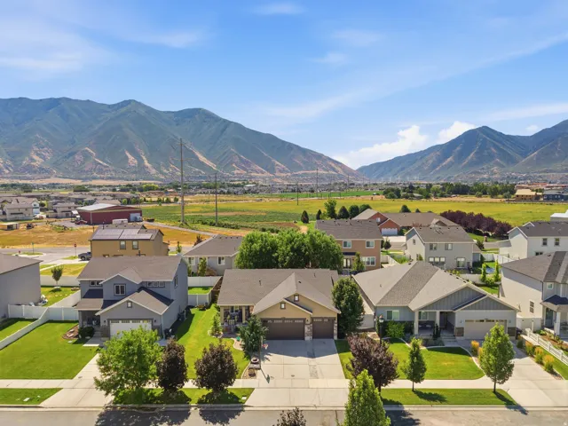 Residential neighborhood featuring a variety of single-family homes with mountain scenery in the background