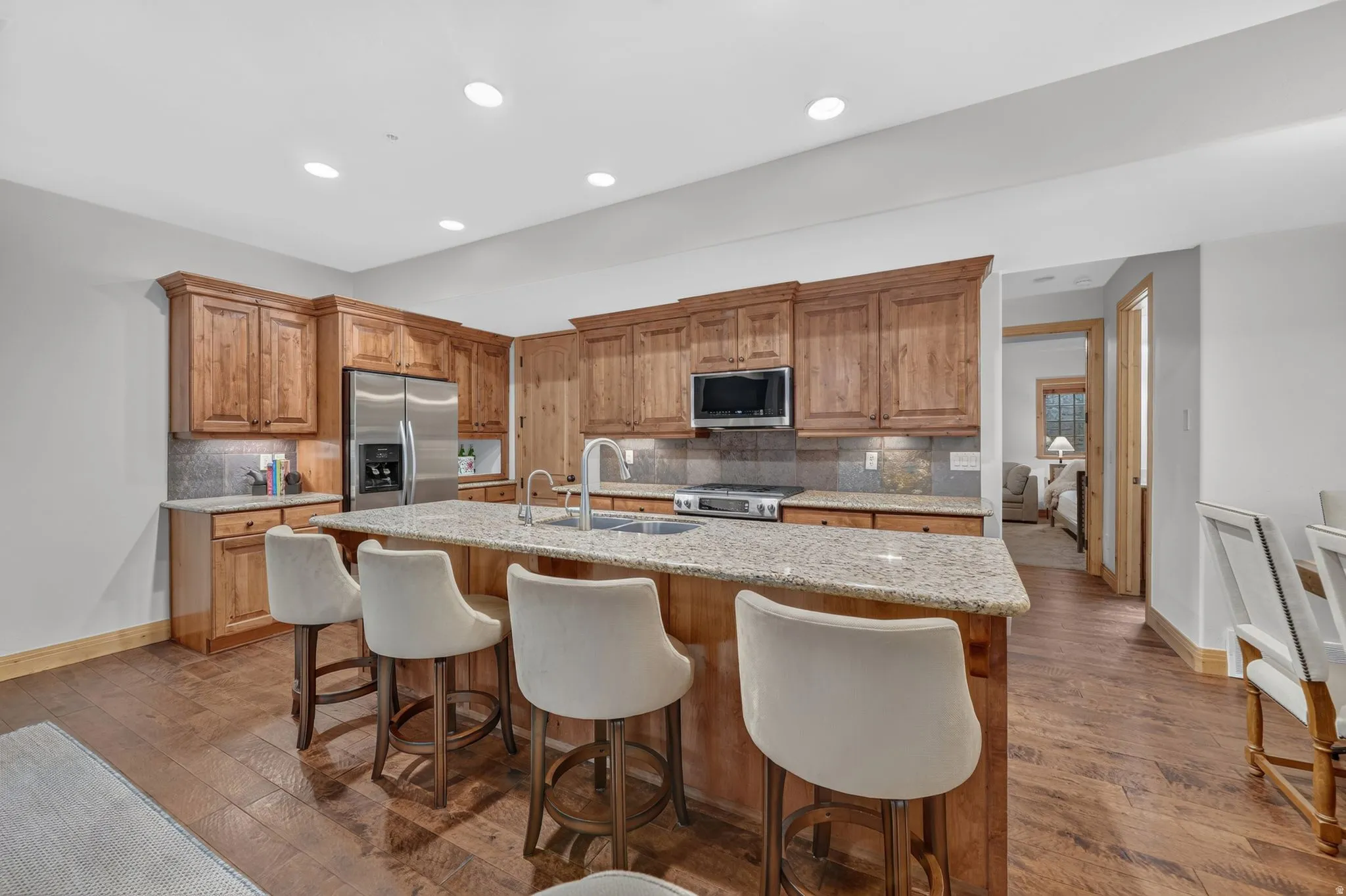 Kitchen featuring wood-finish cabinetry, granite countertops, and stainless steel appliances