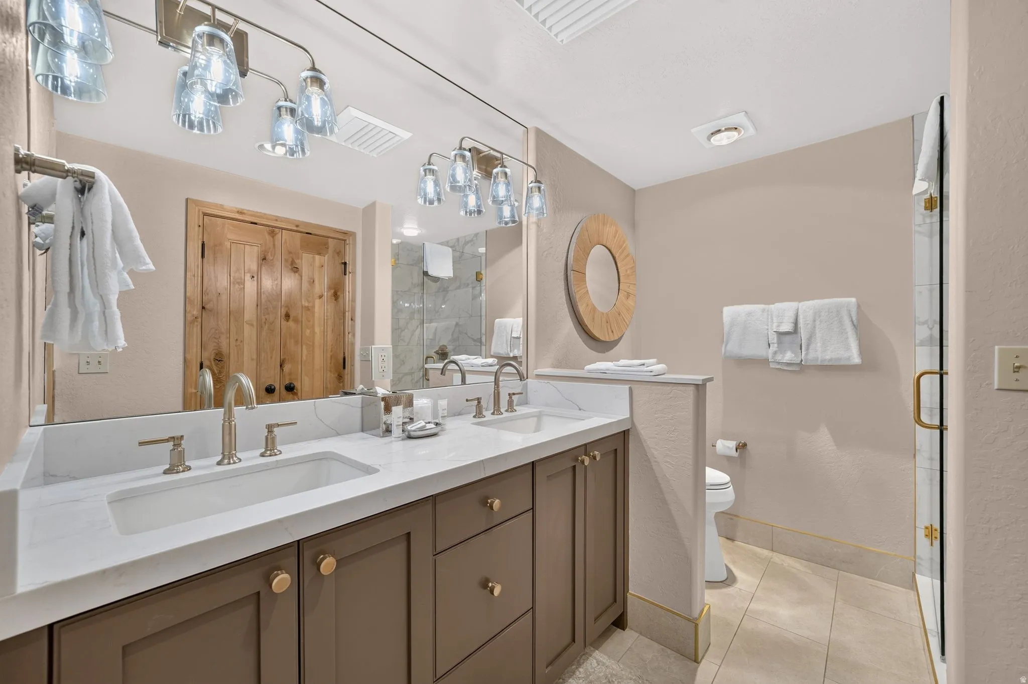 Dual vanity with integrated sinks, white countertops, and brushed nickel faucets