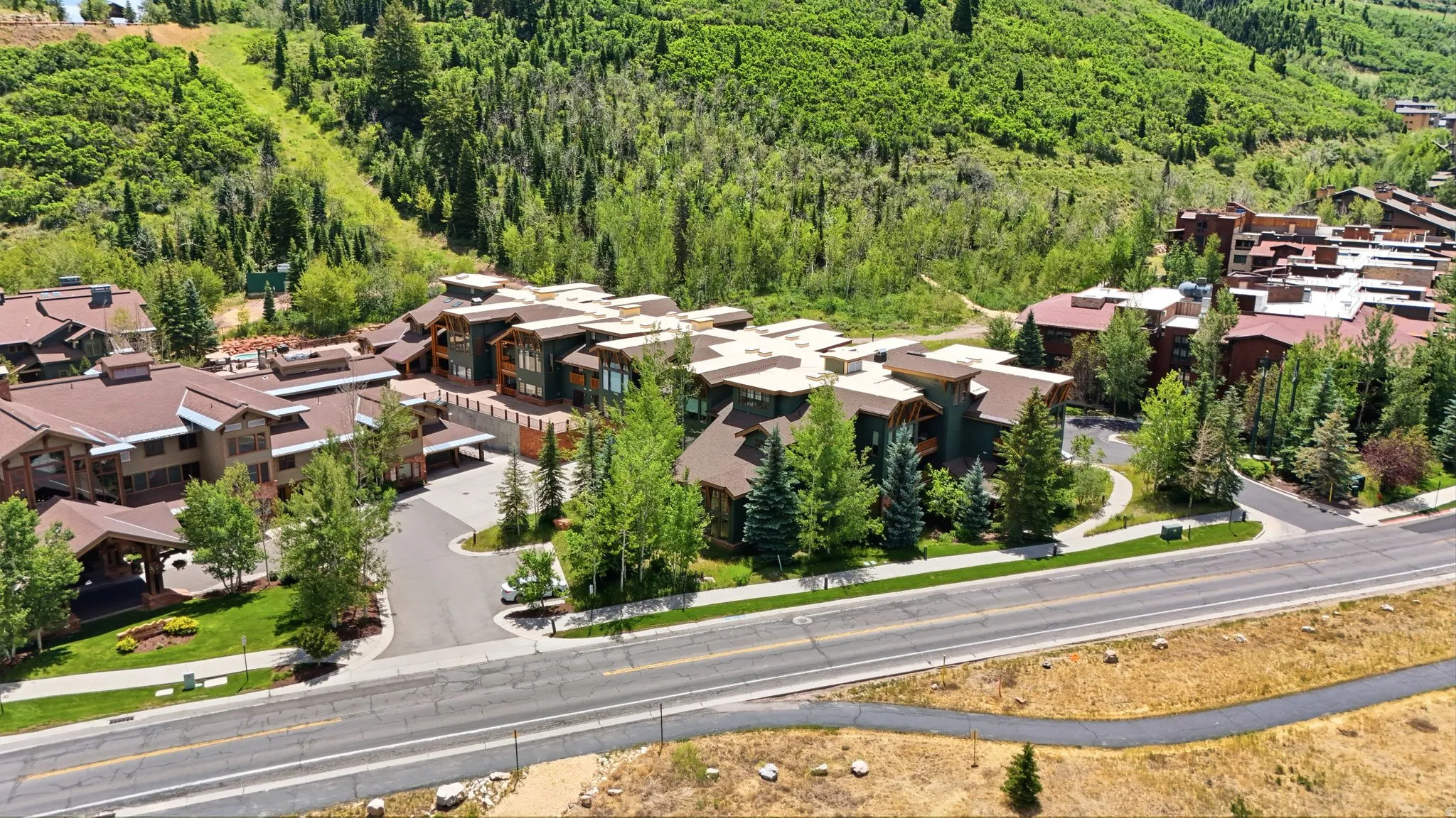 Multi-story structures with varied rooflines and extensive landscaping