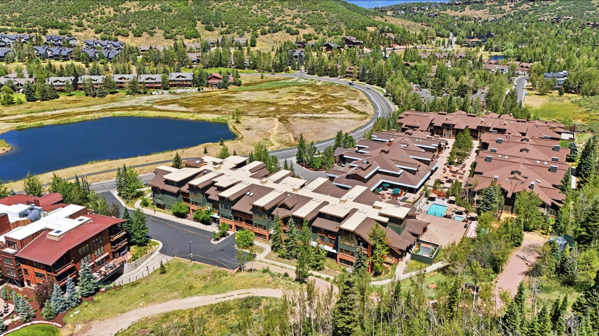 Contemporary condominium complex featuring varied rooflines and extensive exterior balconies