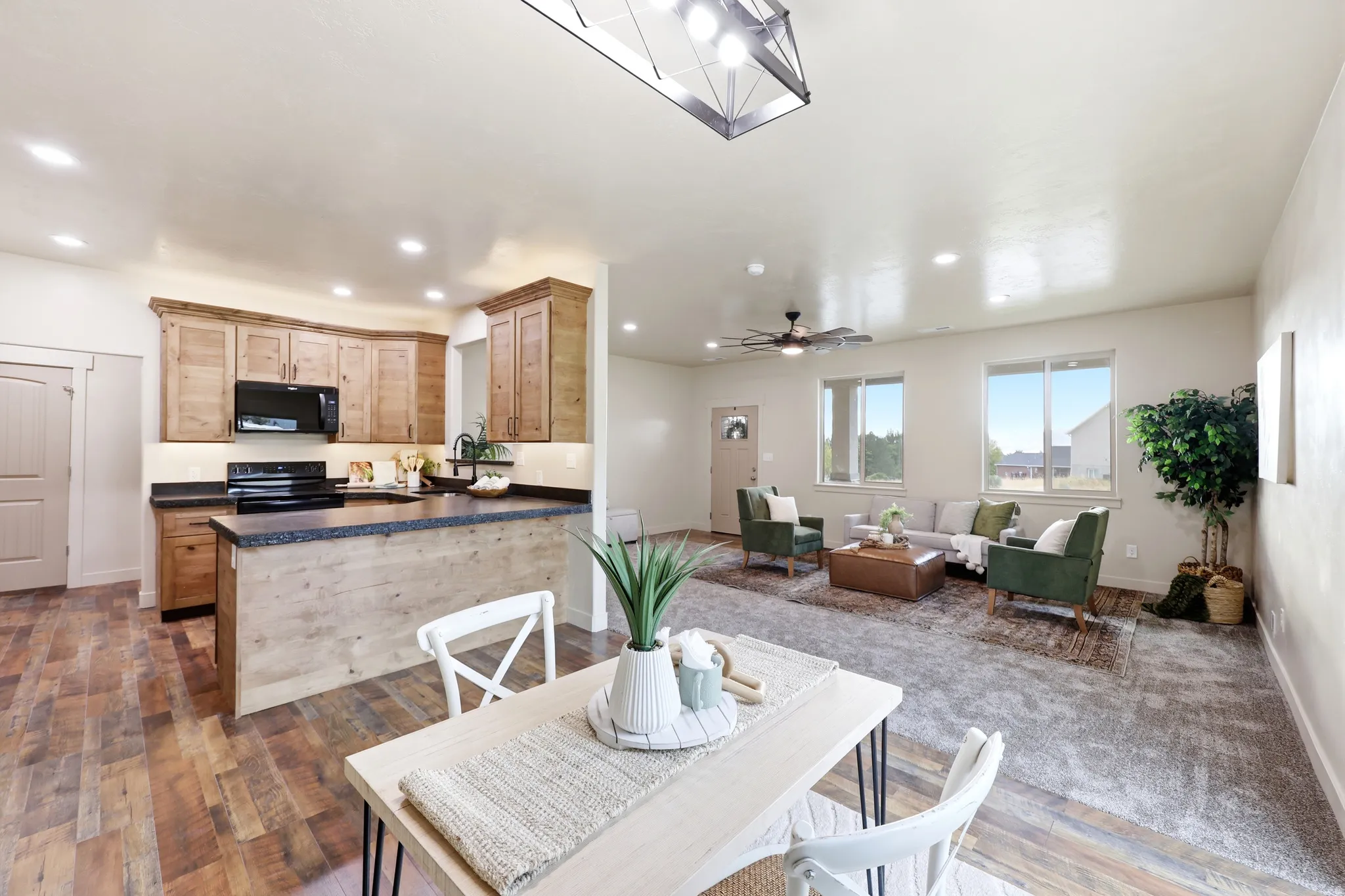 Open concept living area featuring a kitchen, dining space, and living room
