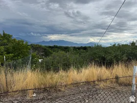 Distant mountain range backdrop and expansive natural landscaping