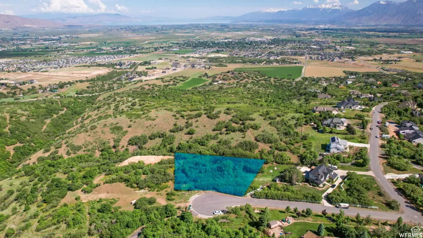 Expansive developable lot, highlighted in blue, featuring varied topography