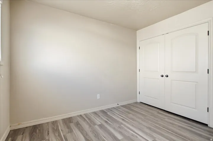 Neutral-toned walls complement wood-finish flooring