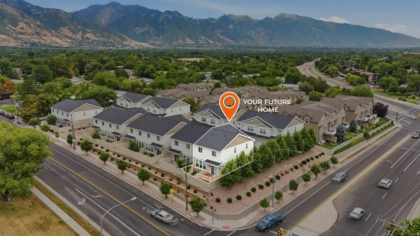 Aerial perspective highlighting a corner unit within a complex of townhomes