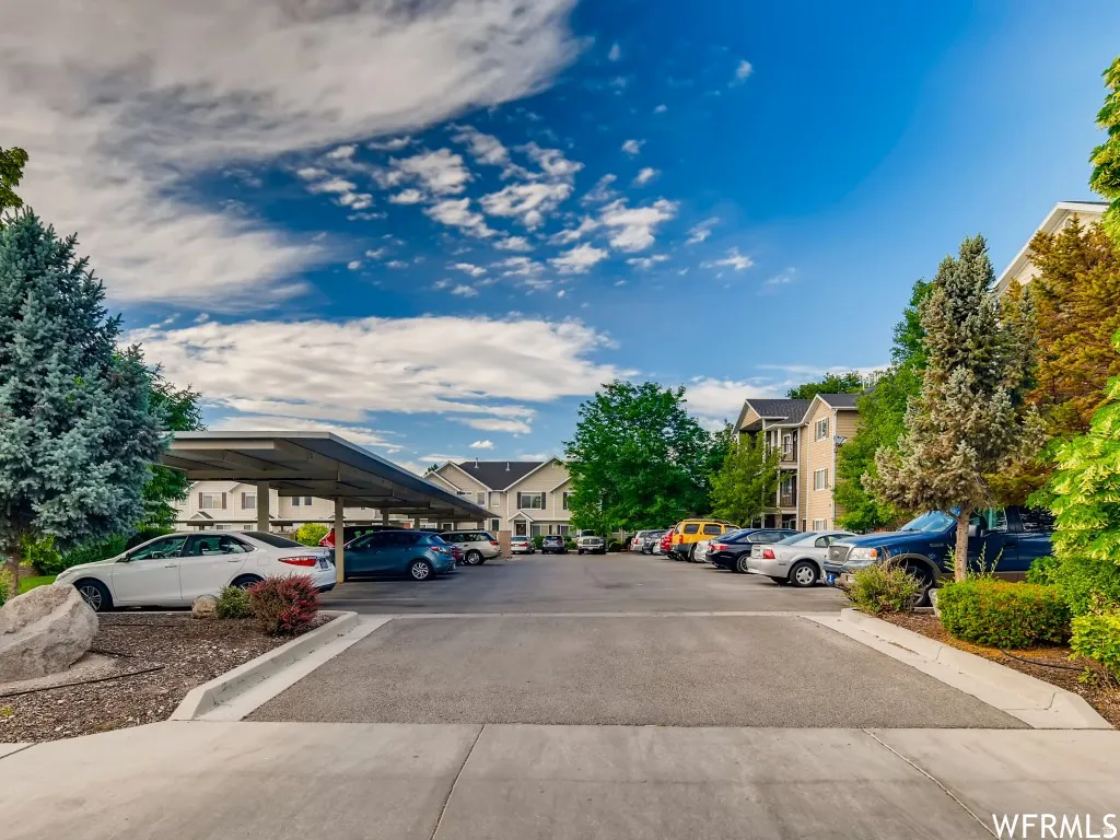 Expansive parking area featuring multiple covered parking structures