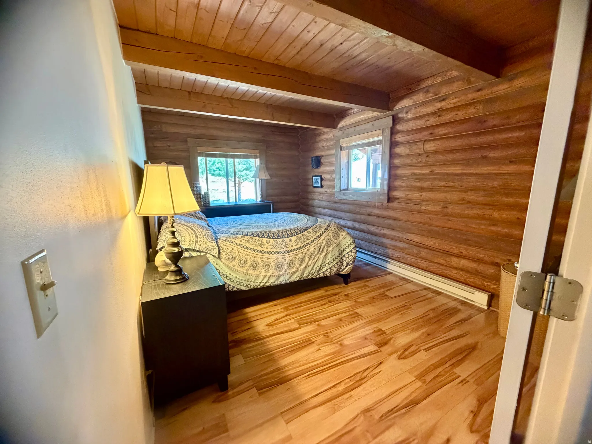 Interior space featuring wood-finish flooring and log walls