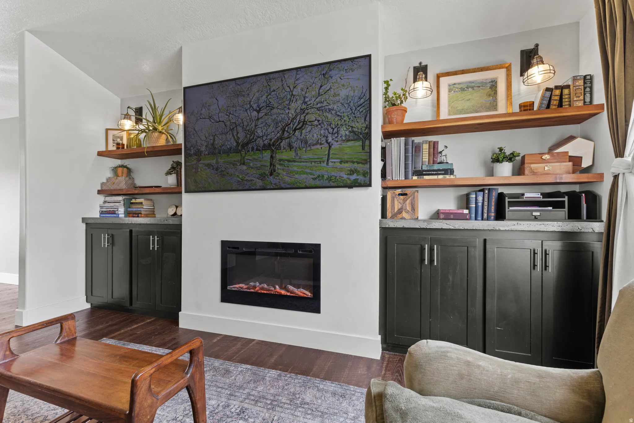 Integrated media wall featuring an electric fireplace and mounted television