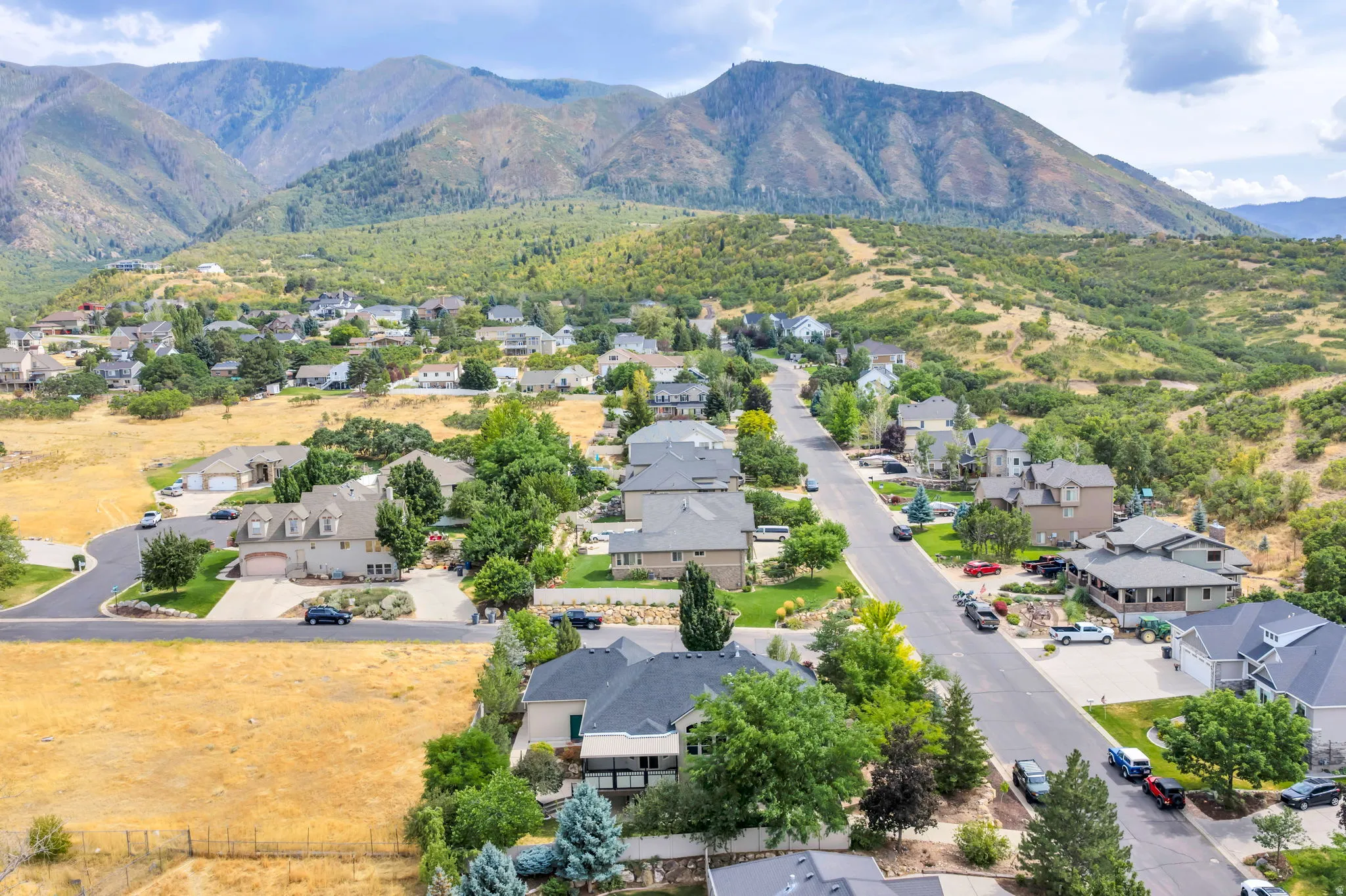 Neighborhood setting with established residential properties and mountainous terrain