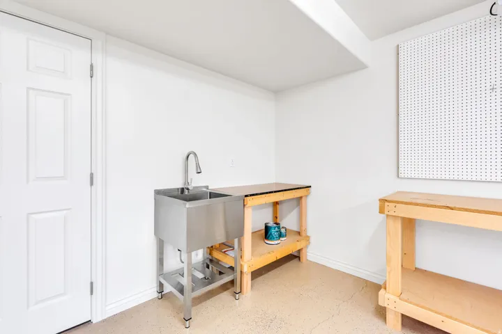 Stainless steel utility sink with a gooseneck faucet