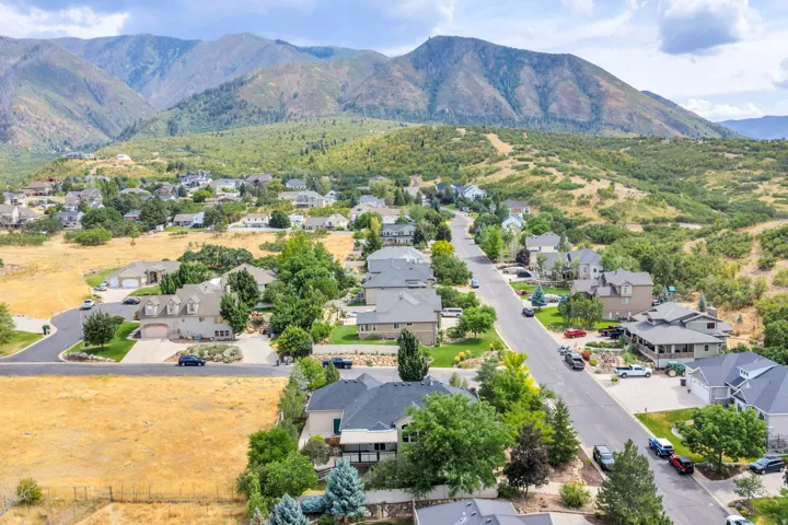 Neighborhood setting with established residential properties and mountainous terrain
