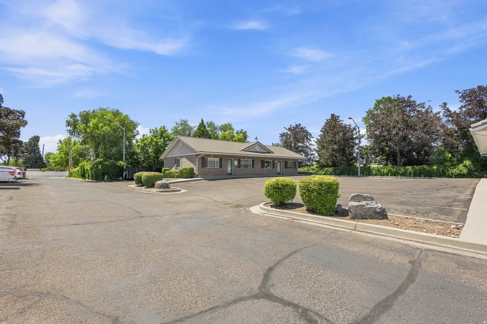 Expansive asphalt parking lot with multiple paved spaces