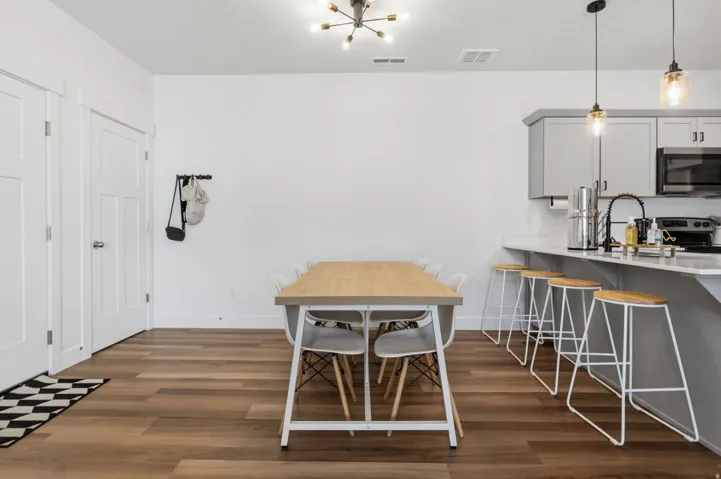 Open-concept living space featuring wood-finish flooring throughout