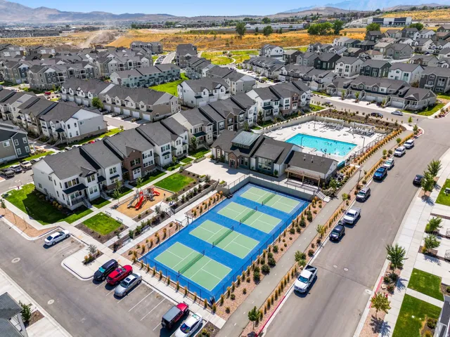 Community amenities featuring a swimming pool, tennis courts, and a playground