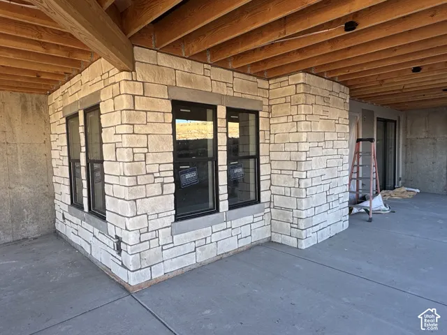 Modern construction featuring a light-colored stone exterior with clean architectural lines