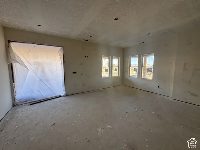 Interior space featuring recessed lighting, four dual-pane windows, and a large portal opening