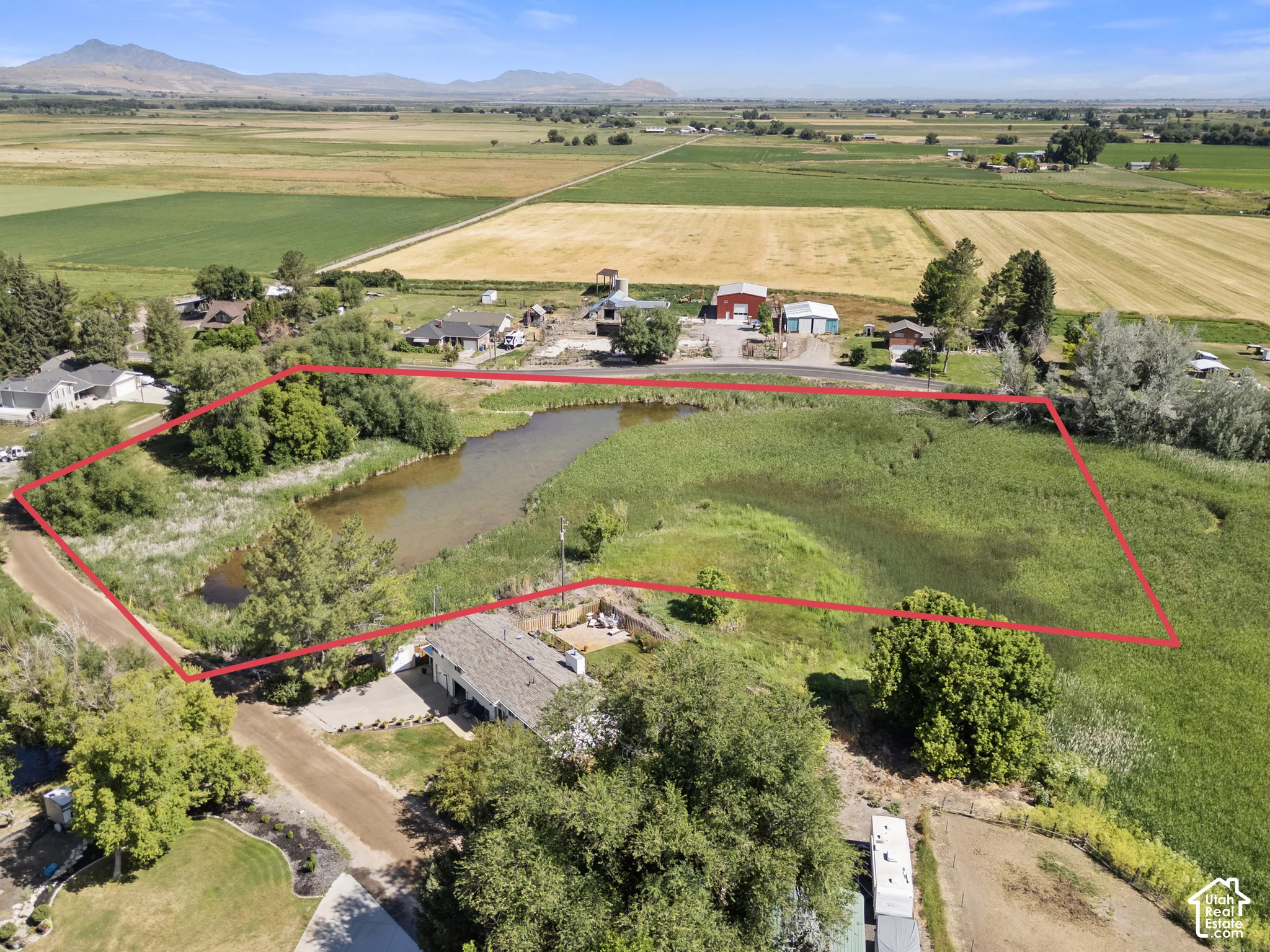 Expansive lot featuring a natural pond and surrounding wetlands