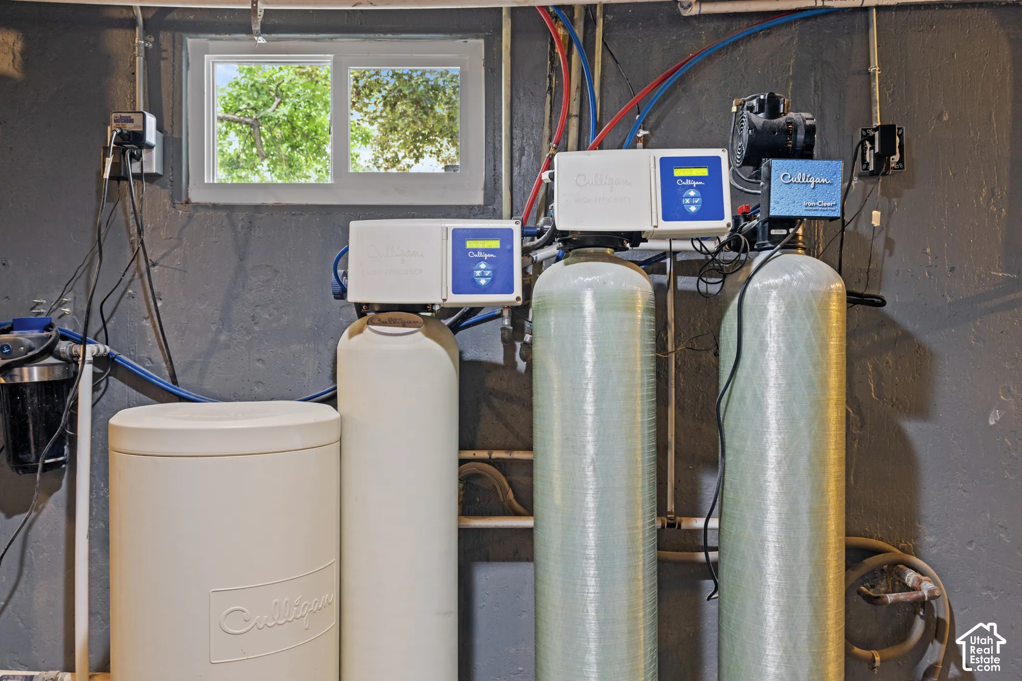 Comprehensive water treatment system featuring multiple tanks, filtration units, and associated plumbing