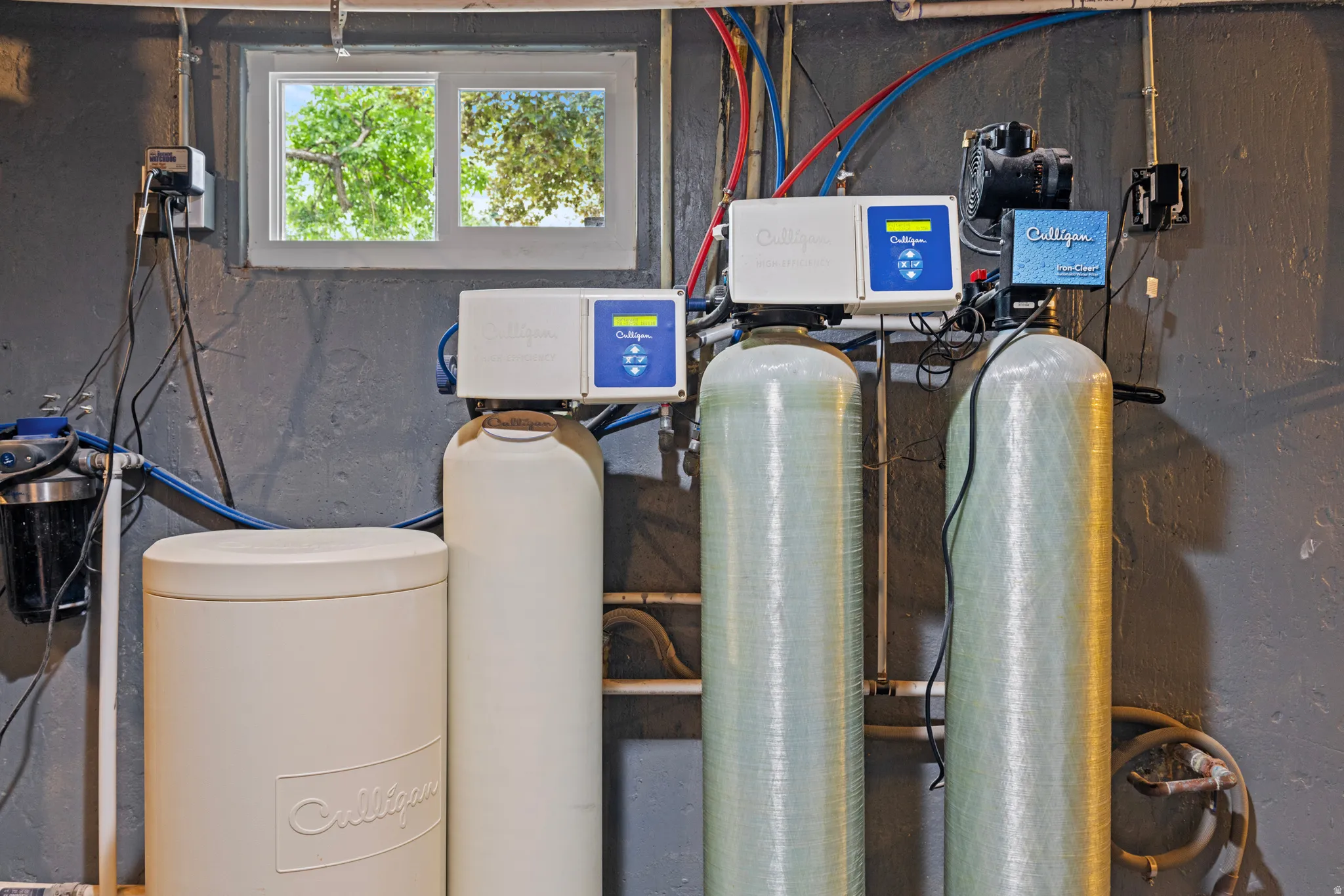 Comprehensive water treatment system featuring multiple tanks, filtration units, and associated plumbing