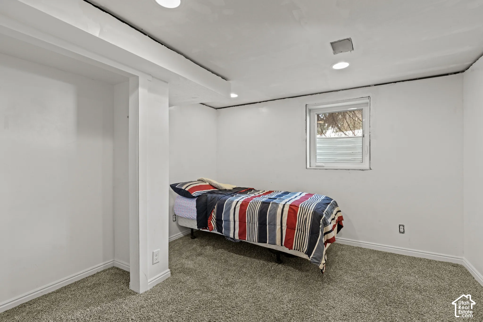 Bedroom featuring a window, recessed lighting, carpeting, and white baseboards