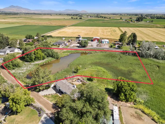 Expansive lot featuring a natural pond and surrounding wetlands