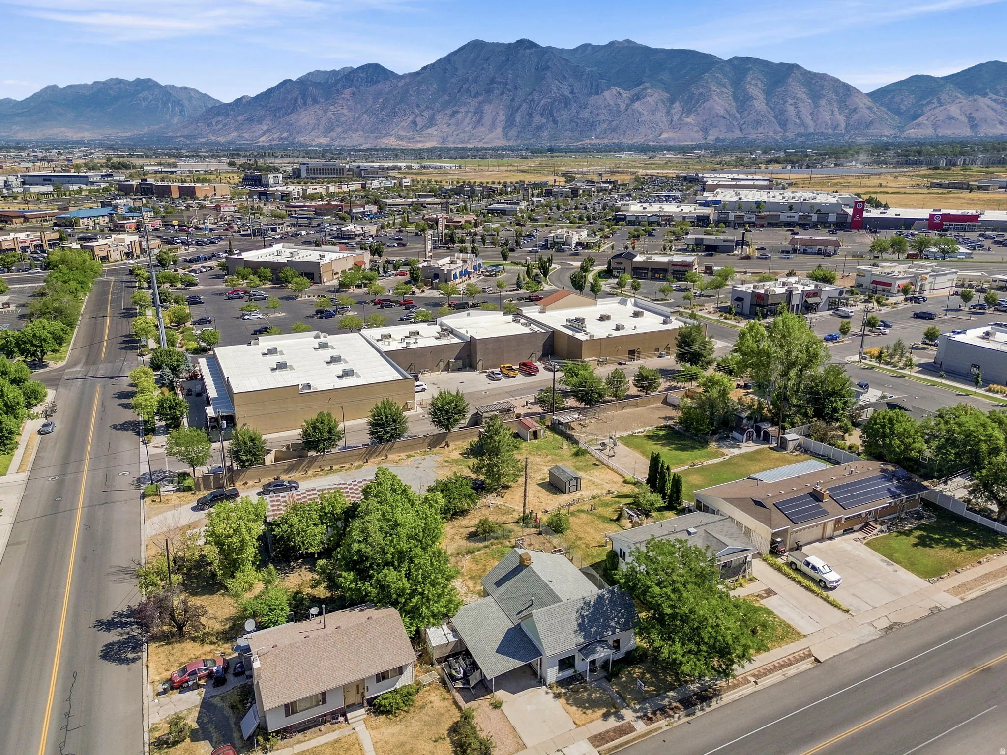 Aerial perspective featuring residential properties alongside commercial buildings