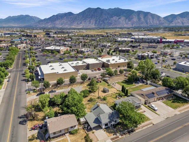 Aerial perspective featuring residential properties alongside commercial buildings